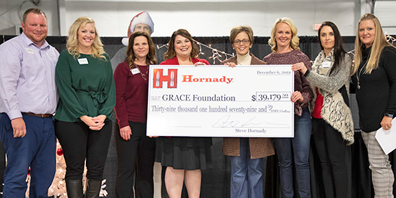 Photo of Grace Foundation receiving donation